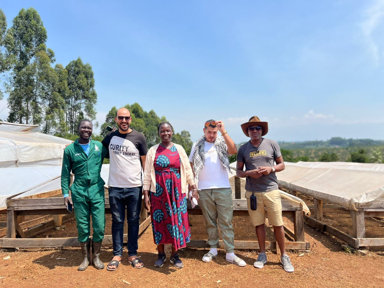 Members of the farmers group standing at the farm's processing site