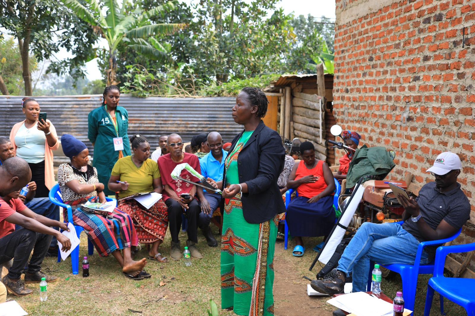 Farmers gathered outdoors for a group meeting